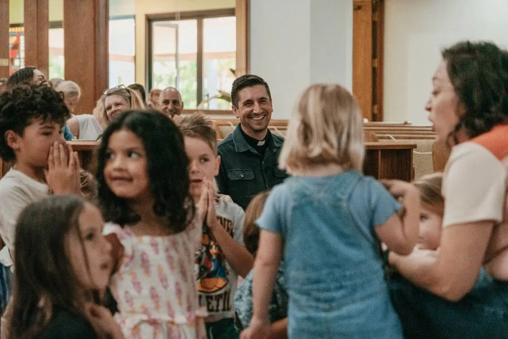 Children and adults gathered together in the congregation.